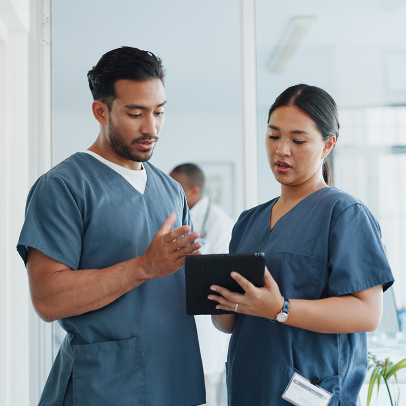 yolo-800x800-99 Two nurses looking at a tablet together